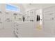 Large walk-in closet with ample shelving, drawers, and hanging space at 9009 Meadow Pointe Ct, Wake Forest, NC 27587
