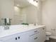 Well-lit bathroom with double sink vanity, white countertops, and modern fixtures at 1721 Grassy Falls Ln, Wendell, NC 27591