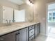 A bright bathroom showcases double sinks with ample counter space and modern fixtures at 1721 Grassy Falls Ln, Wendell, NC 27591