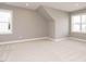 Bright bedroom showcasing neutral carpeting, clean trim work and fresh paint at 1721 Grassy Falls Ln, Wendell, NC 27591