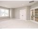 Spacious bedroom with French doors and large windows offering abundant light at 1721 Grassy Falls Ln, Wendell, NC 27591