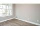 Bright, airy bedroom with hardwood floors and large windows at 1721 Grassy Falls Ln, Wendell, NC 27591