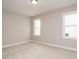 Neutral bedroom with carpet, recessed lighting and two windows for natural light at 1721 Grassy Falls Ln, Wendell, NC 27591