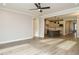 Modern living room offers hardwood floors and open concept to the kitchen for seamless entertaining at 1721 Grassy Falls Ln, Wendell, NC 27591