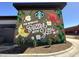 A colorful mural on a Starbucks building showcases local art and promotes community engagement at 1721 Grassy Falls Ln, Wendell, NC 27591