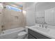 Bright bathroom featuring a shower-tub combo with tiled walls and a contemporary vanity with a sleek sink at 110 Summerlin Dr, Clayton, NC 27527