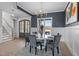 Elegant dining room with a round table, stylish chandelier, and natural light at 110 Summerlin Dr, Clayton, NC 27527