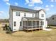 Rear exterior of two-story home featuring a cozy screened porch perfect for outdoor entertaining at 110 Summerlin Dr, Clayton, NC 27527