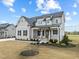 Inviting two-story home with a covered entry, complemented by manicured landscaping at 110 Summerlin Dr, Clayton, NC 27527
