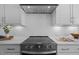 Close-up of a kitchen with sleek appliances, white subway tile backsplash, and ample counter space at 110 Summerlin Dr, Clayton, NC 27527