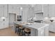 Bright kitchen featuring a large island with seating, pendant lights, and modern appliances at 110 Summerlin Dr, Clayton, NC 27527