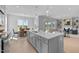 Open-concept kitchen with a large island, seamless flow to dining and living areas at 110 Summerlin Dr, Clayton, NC 27527