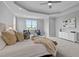 Bright main bedroom features sitting area, large bed, and neutral decor at 110 Summerlin Dr, Clayton, NC 27527