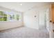 This is a carpeted room with natural light and bright white trim at 73 Artic Cir, Garner, NC 27529