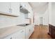 Home office with wood desk, large artwork, and natural light at 73 Artic Cir, Garner, NC 27529