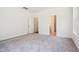 Spacious, carpeted bedroom with neutral walls and ample natural light from a bright window at 73 Artic Cir, Garner, NC 27529