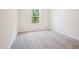 Empty bedroom with carpet, a single window, and a neutral color palette at 73 Artic Cir, Garner, NC 27529