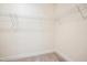 Walk-in closet with wire shelving and neutral carpeting at 73 Artic Cir, Garner, NC 27529