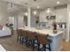 Island kitchen with quartz countertops, stainless steel appliances, and pendant lighting at 73 Artic Cir, Garner, NC 27529