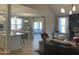 Open-concept living area with hardwood floors, a modern kitchen island, and cozy seating area at 73 Artic Cir, Garner, NC 27529