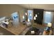 Open concept living room with dining and seating areas, with high ceilings and natural lighting at 73 Artic Cir, Garner, NC 27529
