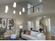 View of living room with stairs leading to a loft overlooking the seating area at 73 Artic Cir, Garner, NC 27529