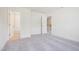 Spacious bedroom with a view of an ensuite bathroom and the staircase at 73 Artic Cir, Garner, NC 27529