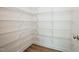 Well-organized walk-in closet with multiple shelves, providing ample storage space at 73 Artic Cir, Garner, NC 27529