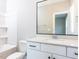 Bathroom featuring bathtub/shower combination, white vanity and modern fixtures at 1156 Cottonsprings Dr, Wendell, NC 27591
