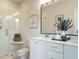 Elegant bathroom with a glass-enclosed shower, double sink vanity, and modern fixtures at 1156 Cottonsprings Dr, Wendell, NC 27591