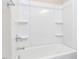 Bathtub and shower combination with molded shelves for easy access at 1156 Cottonsprings Dr, Wendell, NC 27591
