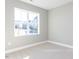 Neutral bedroom with carpet, a large window offering natural light, and a view of the neighborhood at 1156 Cottonsprings Dr, Wendell, NC 27591