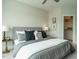 Well-lit bedroom features a comfortable bed, carpet flooring, and closet for ample storage at 1156 Cottonsprings Dr, Wendell, NC 27591