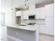 Bright kitchen showcases a center island and stainless steel appliances at 1156 Cottonsprings Dr, Wendell, NC 27591