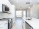 Modern kitchen featuring stainless steel appliances and white cabinetry at 1156 Cottonsprings Dr, Wendell, NC 27591