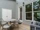 Charming outdoor patio offering a cozy seating area, dining set, and views at 1156 Cottonsprings Dr, Wendell, NC 27591