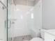 Modern tiled shower with glass door, shower head, and built-in bench at 1156 Cottonsprings Dr, Wendell, NC 27591