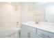 Clean bathroom includes shower over tub, a sink with storage and light fixtures at 3402 St Barts Pl, Mebane, NC 27302