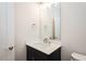 Modern powder room features a sleek vanity with a stylish mirror and fixtures at 3402 St Barts Pl, Mebane, NC 27302
