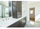 Bathroom with double vanity, modern cabinets, and fixtures in a well-lit space at 3402 St Barts Pl, Mebane, NC 27302
