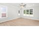 Sunlit bedroom with large windows and a ceiling fan for comfortable living at 3402 St Barts Pl, Mebane, NC 27302