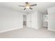 Spacious bedroom featuring plush carpeting, a ceiling fan, and a double door closet at 3402 St Barts Pl, Mebane, NC 27302
