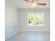 The bedroom features a large window overlooking trees and clear space at 3402 St Barts Pl, Mebane, NC 27302