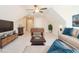 Bonus room styled with TV, game table, seating, and stylish decor at 3402 St Barts Pl, Mebane, NC 27302