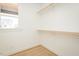 Walk-in closet with wooden shelves and natural light at 3402 St Barts Pl, Mebane, NC 27302