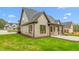 Beautifully landscaped exterior elevation of a newly constructed home with brick facade at 3402 St Barts Pl, Mebane, NC 27302