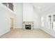 Bright, open living room featuring a soaring ceiling and a charming stone fireplace at 3402 St Barts Pl, Mebane, NC 27302