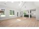 Bright living room with natural light, hardwood floors, and an open layout to the kitchen at 3402 St Barts Pl, Mebane, NC 27302