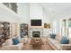 The staged living room offers an inviting space with a fireplace, sofa, and stylish decor at 3402 St Barts Pl, Mebane, NC 27302