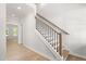 Bright foyer showcases staircase with wood treads, modern railings and a light wood floor at 3402 St Barts Pl, Mebane, NC 27302